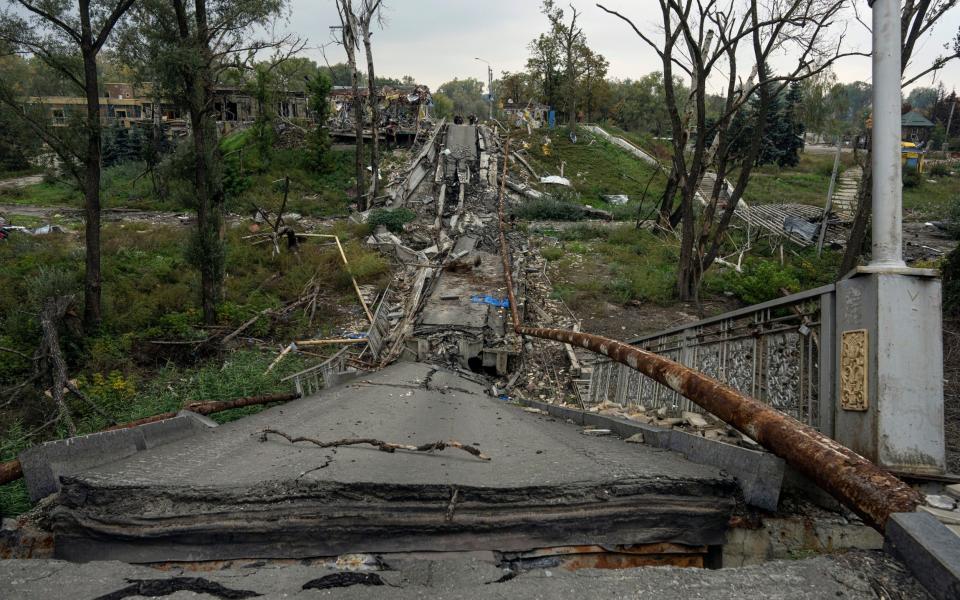 A destroyed bridge across the Siverskyi Donets river in the recently liberated town of Sviatohirsk, Ukraine - Evgeniy Maloletka/AP