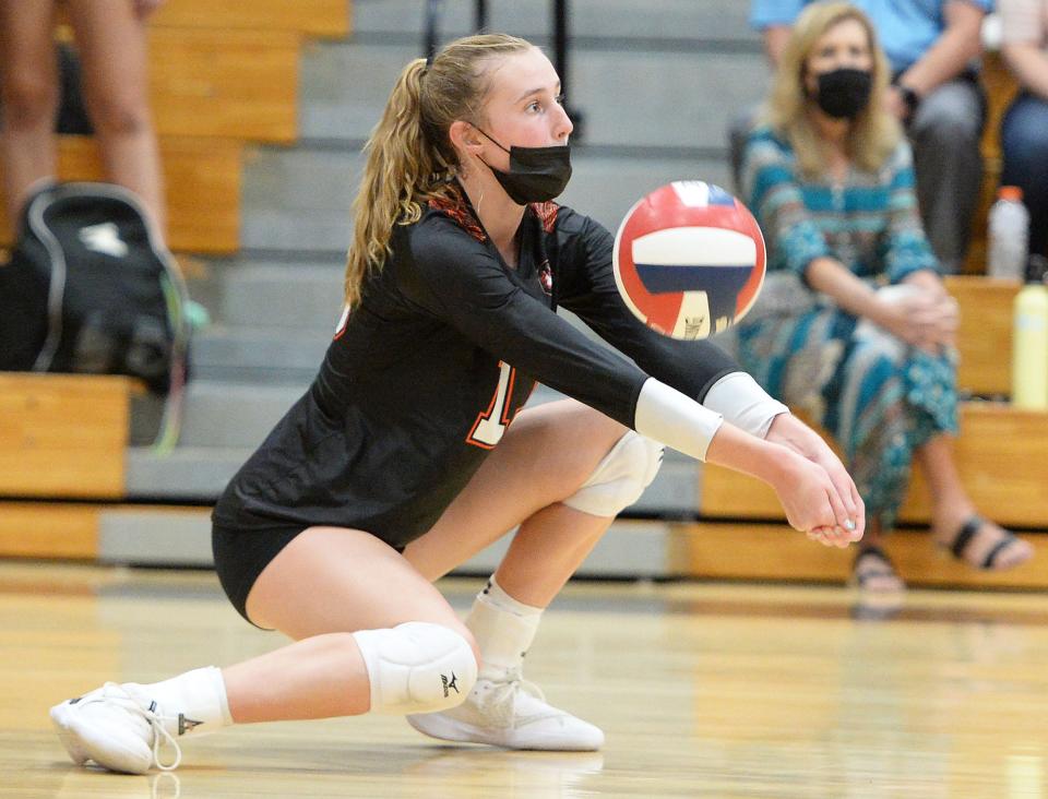 Oliver Ames Sarah Hilliard digs the volleyball during a game against Canton on Monday, Sept. 13, 2021.