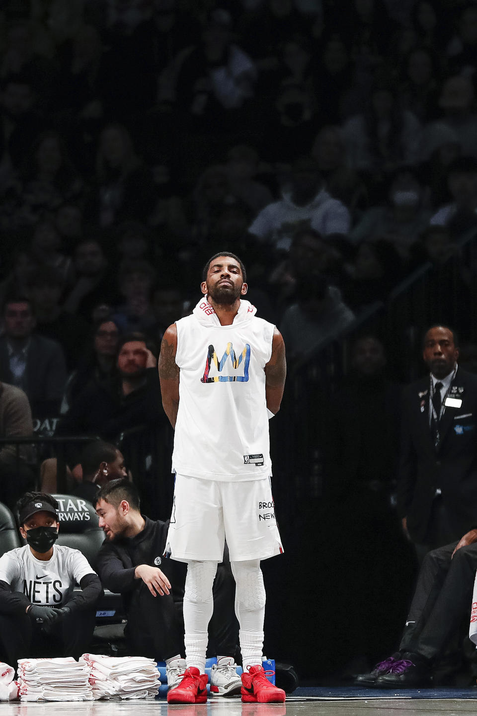 Brooklyn Nets guard Kyrie Irving watches from the bench during the first half of an NBA basketball game against the Memphis Grizzlies Sunday, Nov. 20, 2022, in New York. (AP Photo/Eduardo Munoz Alvarez)