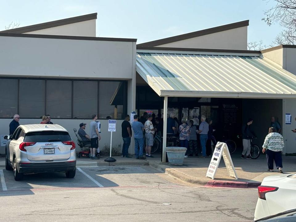 The line to vote in the Republican primary at the polling station located at the White Settlement Public Library extends onto the sidewalk outside on primary Election Day March 5, 2024.