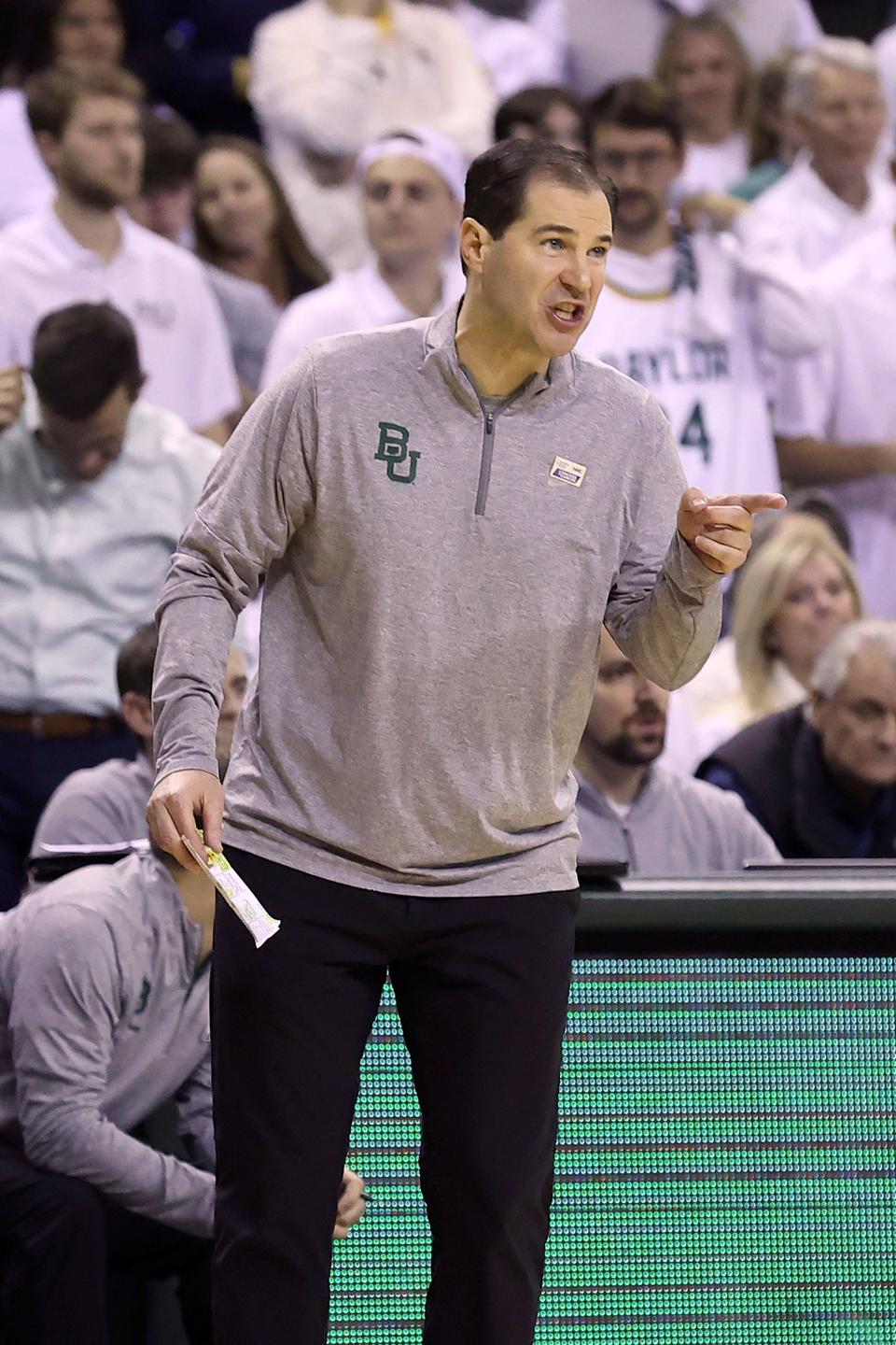 Baylor coach Scott Drew points toward an official after a call during the first half of a game against Kansas on Monday in Waco, Texas.