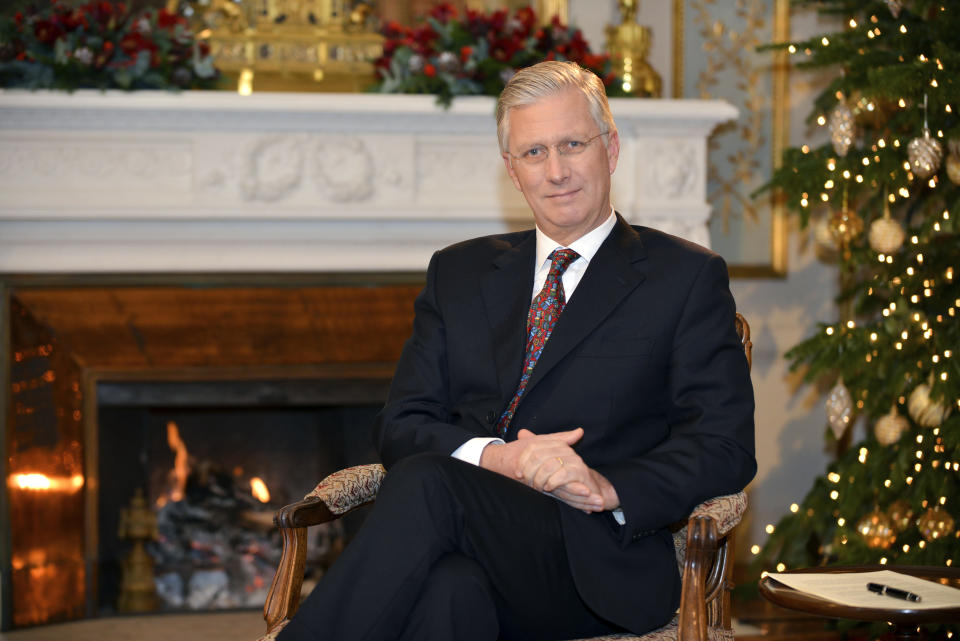 In this photo taken on Monday, Dec. 17, 2018, Belgium's King Philippe poses for a photographer prior to his yearly Christmas message at the Royal Palace in Laeken, Belgium. (Frederic Andrieu/Pool Photo via AP)