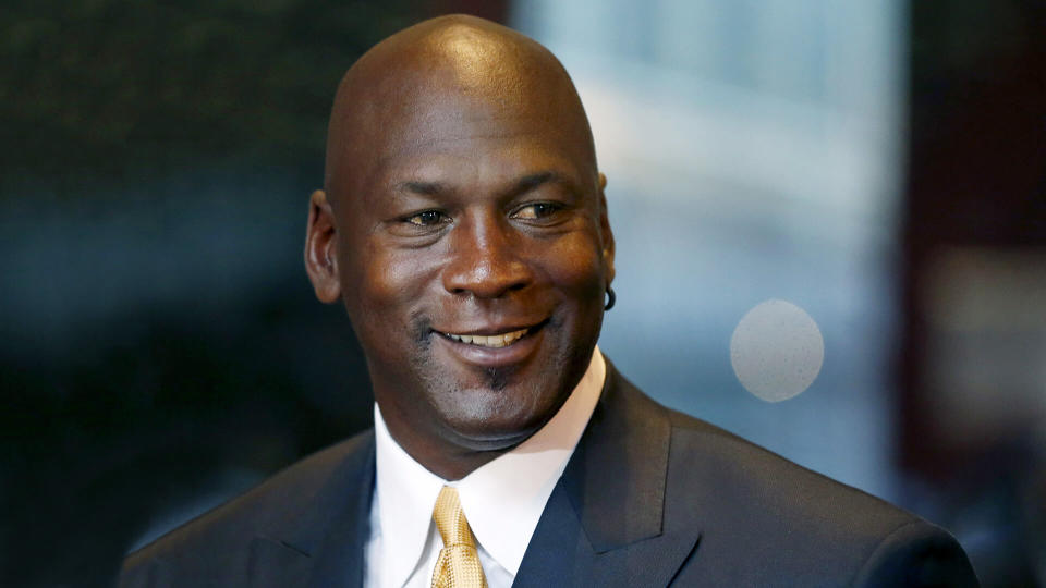 Mandatory Credit: Photo by Charles Rex Arbogast/AP/REX/Shutterstock (6087979b)Michael Jordan Michael Jordan smiles at reporters after a jury ordered a defunct grocery store chain to pay him $8.