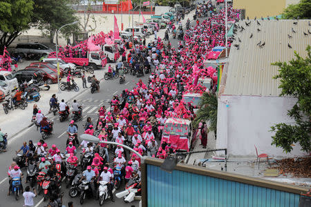 Supporters of the Maldivian President Abdulla Yameen ride on their bikes during the final campaign march rally ahead of their presidential election in Male, Maldives September 22, 2018. REUTERS/Stringer