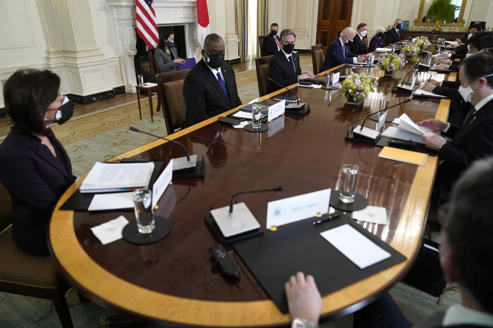 President Joe Biden meets with Japanese Prime Minister Yoshihide Suga in the State Dining Room of the White House, Friday, April 16, 2021, in Washington. (AP Photo/Andrew Harnik)