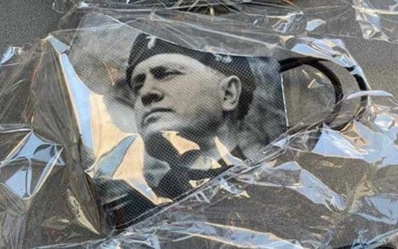 A face mask bearing the image of Mussolini is causing controversy in Italy  - Twitter