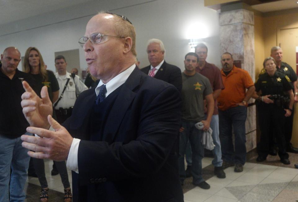 FILE - In this Jan. 6, 2016, file photo attorney David Schoen, speaks at the Broward County Courthouse in Fort Lauderdale, Fla. Former President Donald Trump stands trial before the Senate on an impeachment charge that accuses him of inciting the deadly Jan. 6 riot at the U.S. Capitol. His lawyers foreshadowed in a 78-page memorandum on Monday a range of legal and factual arguments they intend to make at trial. Among those arguments is that the trial is prohibited by the Constitution, that Trump did not incite the riot at the Capitol and that his words are protected by the First Amendment. (Joe Cavaretta//South Florida Sun-Sentinel via AP)