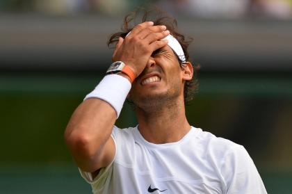 Spain&#39;s Rafael Nadal reacts after a point against Germany&#39;s Dustin Brown during their men&#39;s singles second round match on day four of the 2015 Wimbledon Championships at The All England Tennis Club in Wimbledon, southwest London, on July 2, 2015 (AFP Photo/Glyn Kirk)