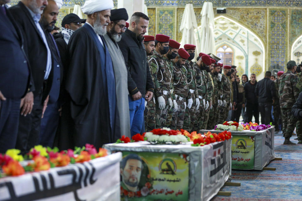 Iraqis attend the funeral of the Kataib Hezbollah members in Najaf, Iraq, Wednesday, Nov 22, 2023. Kataib Hezbollah fighters were killed in the US airstrikes in response to attacks against U.S. forces at Al-Asad Air Base earlier this week. (AP Photo/Anmar Khalil)