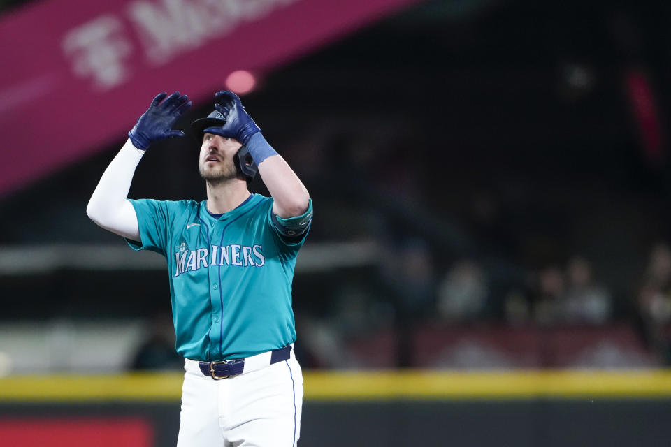 Seattle Mariners' Mitch Garver reacts after hitting a double against the Arizona Diamondbacks during the fifth inning of a baseball game Saturday, April 27, 2024, in Seattle. (AP Photo/Lindsey Wasson)
