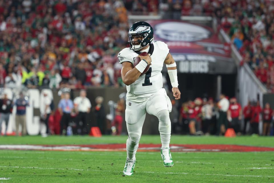 Jan 15, 2024; Tampa, Florida, USA; Philadelphia Eagles quarterback Jalen Hurts (1) runs the ball against the Tampa Bay Buccaneers during the first half of a 2024 NFC wild card game at Raymond James Stadium. Mandatory Credit: Kim Klement Neitzel-USA TODAY Sports