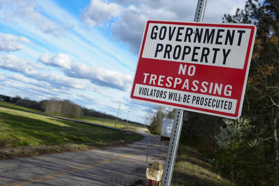 A sign warns against trespassing on government property at the site of a planned Rivian electric truck plant Thursday, March 7, 2024, in Rutledge,Ga. Rivian says it's pausing construction of the $5 billion manufacturing plant in Georgia. (AP Photo/John Bazemore)