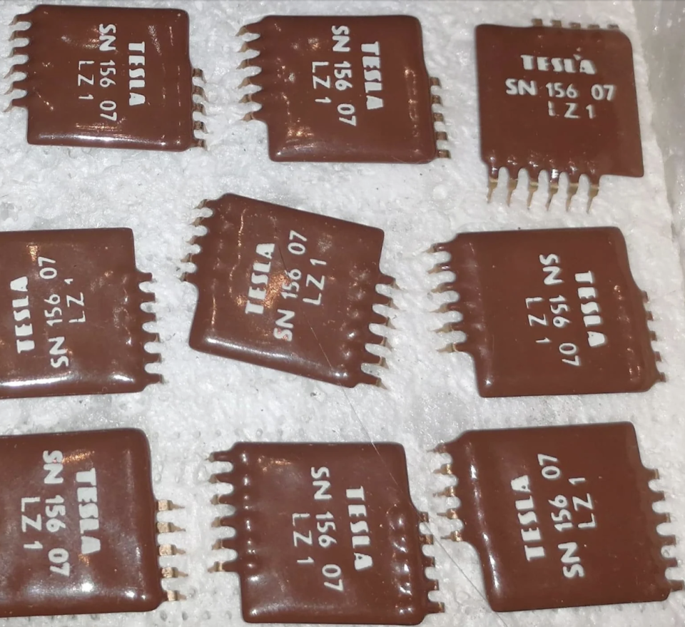 They look like chocolate squares with "Tesla" and a code number on them