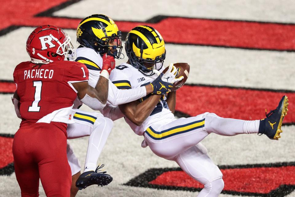 Michigan Wolverines defensive back Daxton Hill (30) intercepts a pass intended for Rutgers Scarlet Knights running back Isaih Pacheco during the third overtime at SHI Stadium, Nov. 22. 2020.