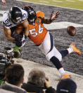 Denver Broncos outside linebacker Nate Irving (56) breaks up a pass in the end zone intended for Seattle Seahawks wide receiver Jermaine Kearse (15) during the first half of the NFL Super Bowl XLVIII football game Sunday, Feb. 2, 2014, in East Rutherford, N.J. (AP Photo/Kathy Willens)