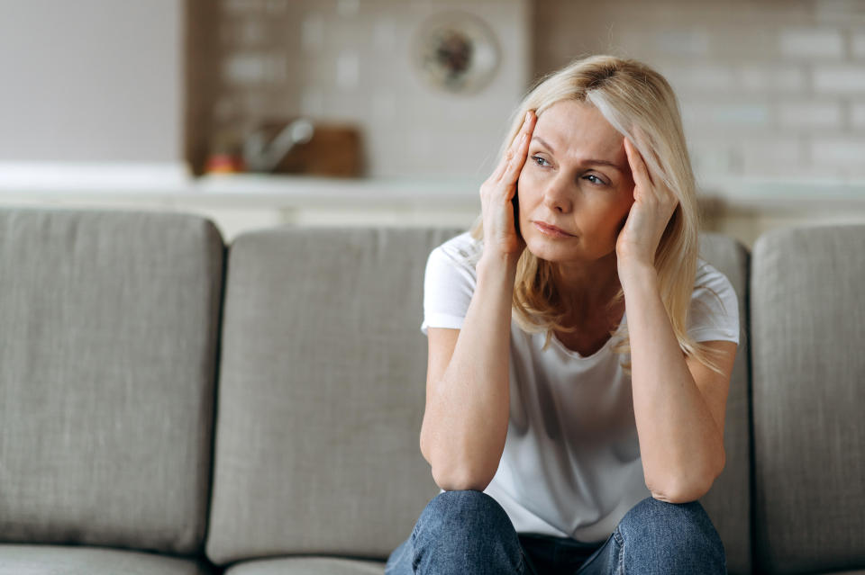Canadian senior women are less likely to see a specialist compared to senior men, and this can have serious impact on their overall health. (Getty) Sad caucasian senior woman wearing casual clothes sits on couch at home alone feels unhappy because of headache, stress, illness or bad news, she needs rest and sleep