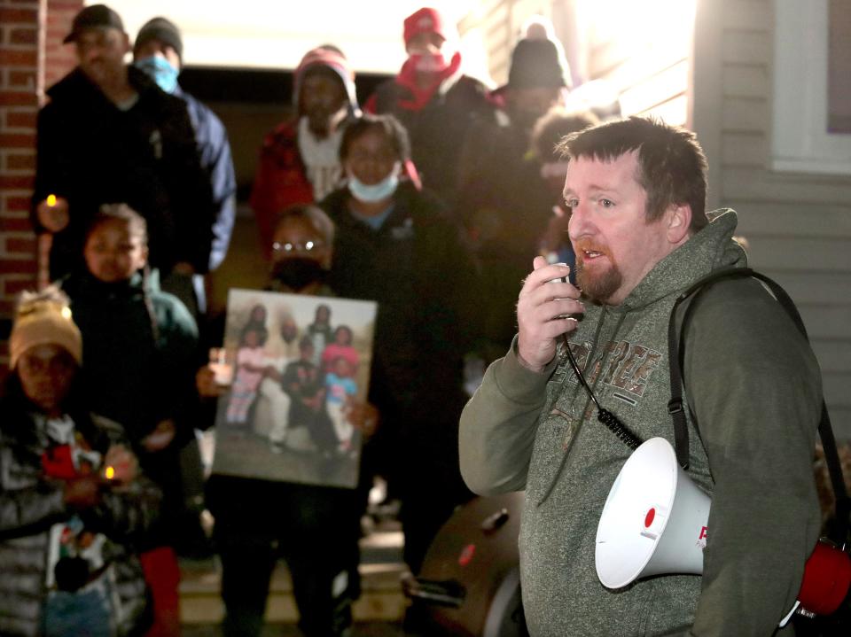 Community activist Joseph Butts speaks during  a candlelight vigil held Wednesday January 5, 2022 in remembrance of 46-year-old James Williams who was shot and killed by Canton police on Jan. 1.