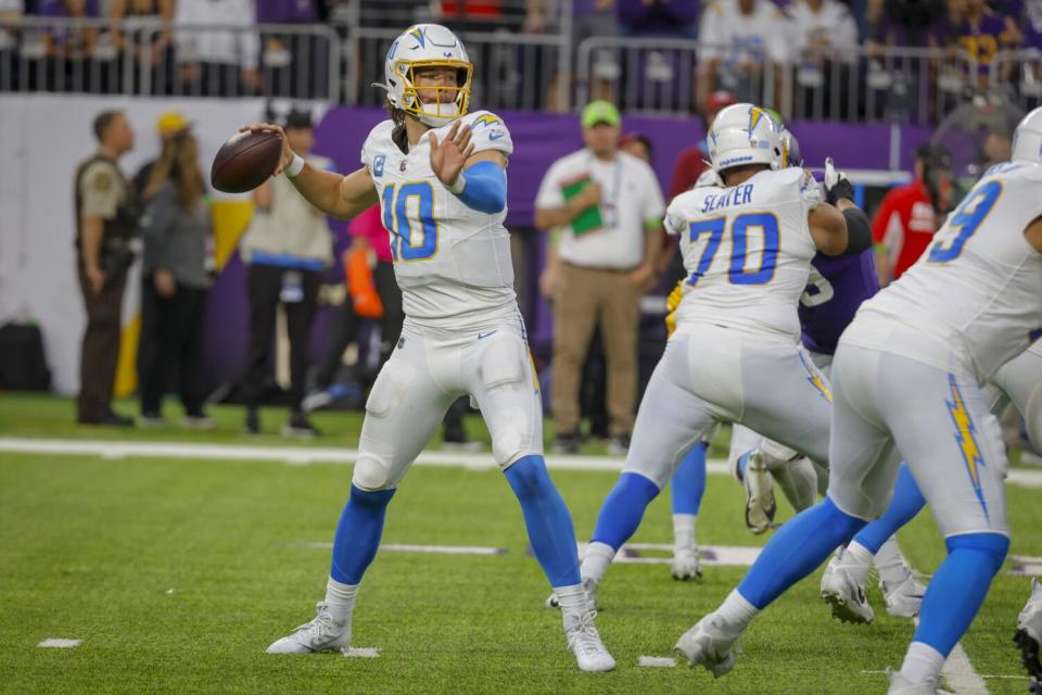 Chargers quarterback Justin Herbert passes against the Minnesota Vikings.