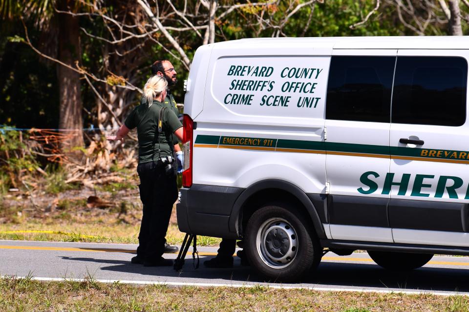 Law enforcement converge on the scene of a quadruple murder March 1 on Alan Shepard Avenue in Canaveral Groves.