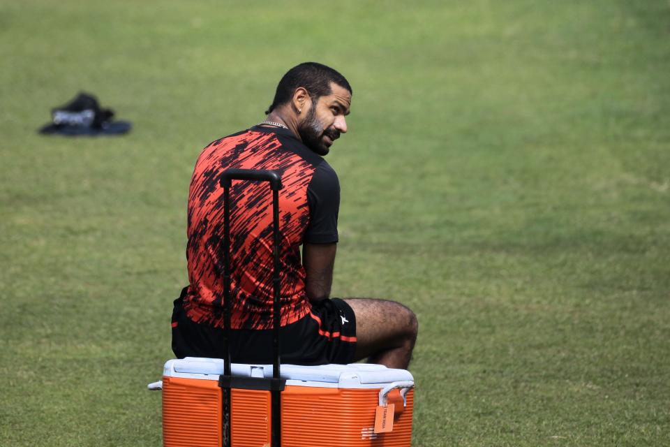 India’s Shikhar Dhawan sits on a box during a practice session ahead of the Asia Cup tournament in Dhaka, Bangladesh, Monday, Feb. 24, 2014. Pakistan plays Sri Lanka in the opening match of the five nation one day cricket event that begins Tuesday. (AP Photo/A.M. Ahad)