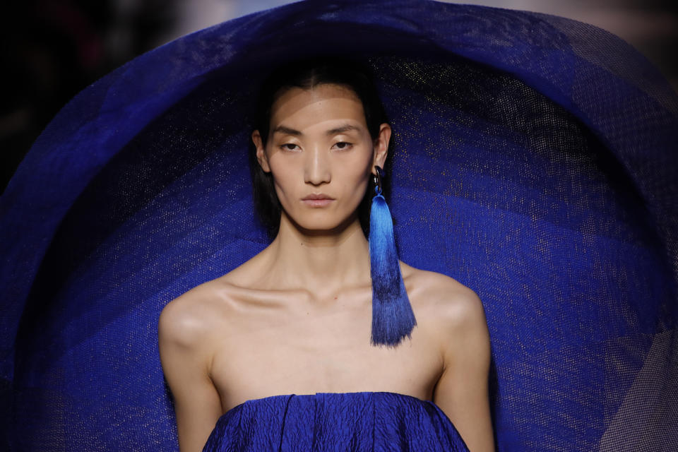 A model wears a creation for the Givenchy Haute Couture Spring/Summer 2020 fashion collection presented Tuesday Jan. 21, 2020 in Paris. (AP Photo/Christophe Ena)