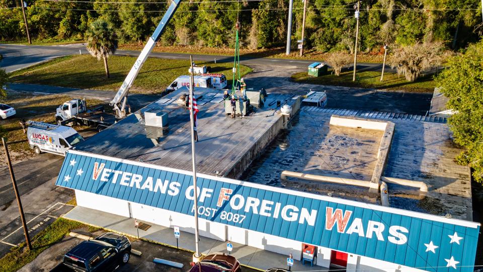 Lucas Air Conditioning, Eustis Roofing and Edâ€™s Crane install a new air conditioning unit at the Mount Dora VFW. [submitted] cindy peterson