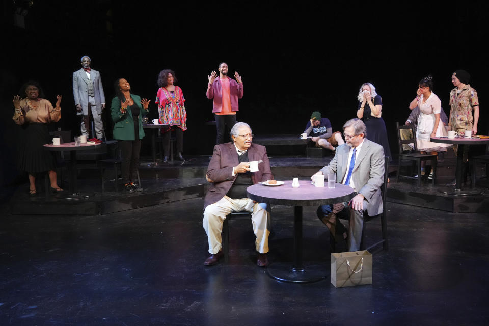 This image shows Count Sovall, foreground left, and John L. Payne, foreground right, with the cast during a performance of "American Rot," playing through March 31 at the Ellen Stewart Theatre in New York. (Steven Pisano/Sam Rudy Public Relations via AP)