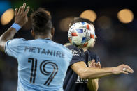 Minnesota United's Romain Metanire (19) throws the ball at Philadelphia Union's Kai Wagner (27) during the second half of an MLS soccer match Wednesday, Oct. 20, 2021, in St. Paul, Minn. Metanire was issued a red card. (Carlos Gonzalez/Star Tribune via AP)