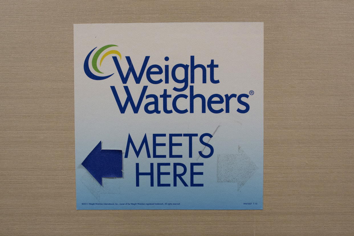 A sign for Weight Watchers is displayed at  office in lower Manhattan, New York October 19, 2015. Oprah Winfrey will buy a 10 percent stake in Weight Watchers International Inc, adding her celebrity and consumer appeal to a diet brand that has been shedding subscribers. REUTERS/Brendan McDermid 