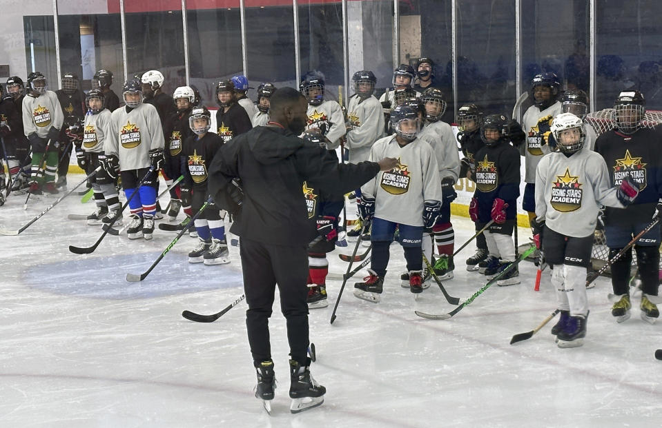 FILE - Duanté Abercrombie speaks to players as an instructor at the Washington Capitals' inaugural Rising Stars Academy in Arlington, Va., Aug. 20, 2023. Tennessee State has taken its biggest step yet toward becoming the first historically Black college and university to introduce ice hockey by hiring Abercrombie as coach. (AP Photo/Stephen Whyno, File)