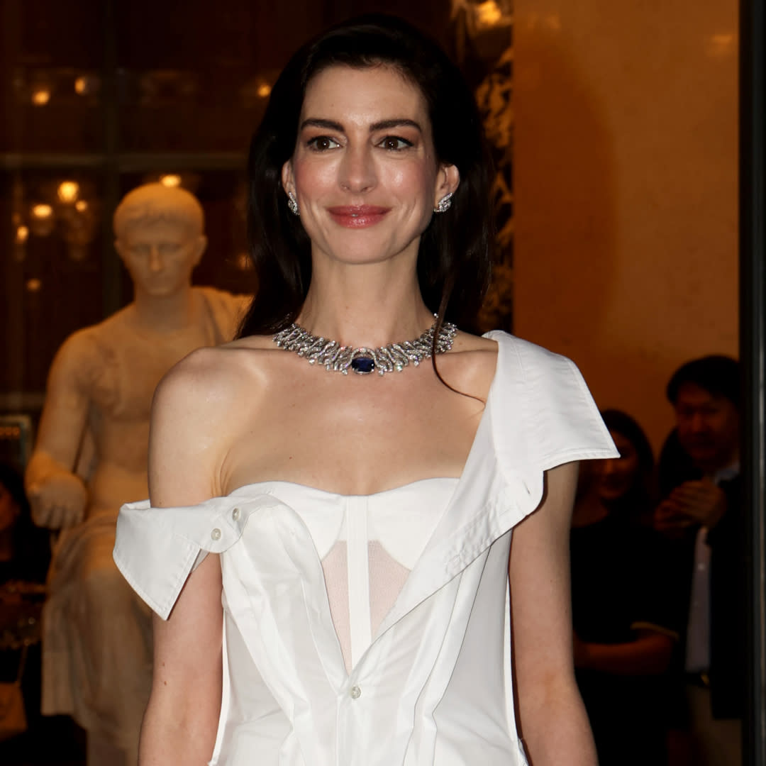  Anne Hathaway wears a Gap deconstructed shirt dress while attending a Bulgari fashion show. 