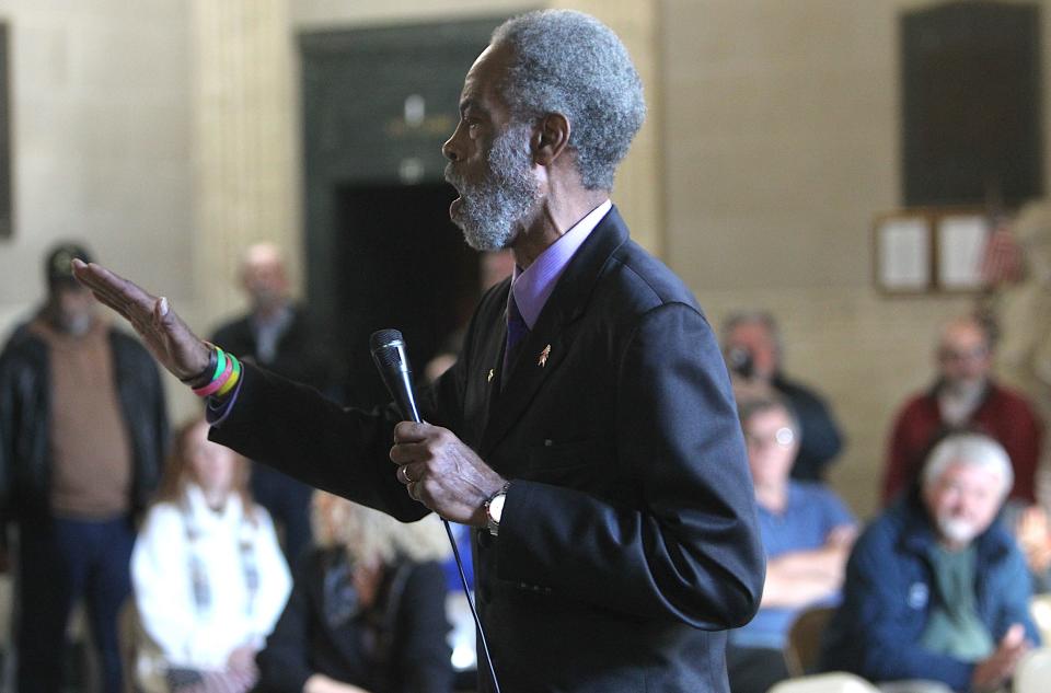 Clarence Crown sings a song in the Bedford Courthouse rotunda to kick off the Unity in Our Community event. The annual celebration was started by Brown 34 years ago, and he has remained the main organizer.