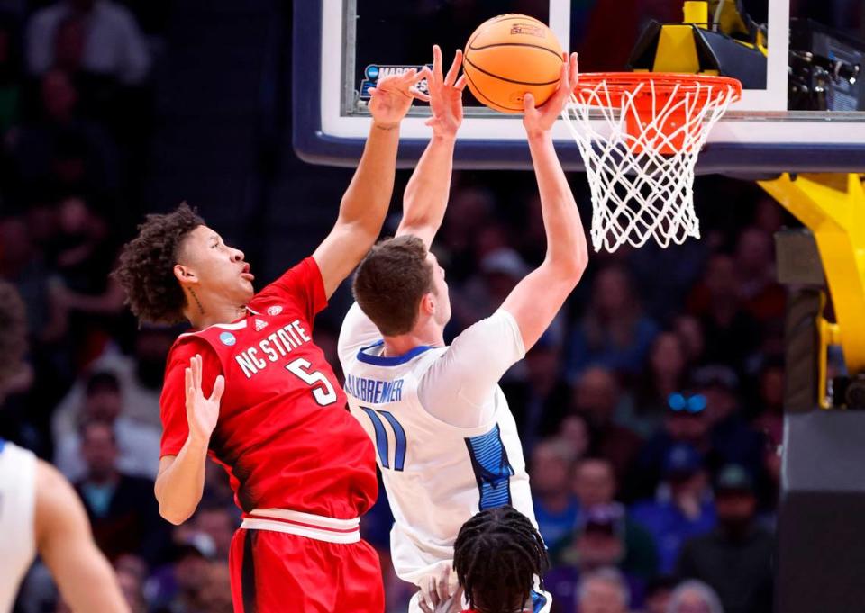 N.C. State’s Jack Clark (5) defends Creighton’s Ryan Kalkbrenner (11) during the first half of N.C. State’s game against Creighton in the first round of the NCAA Tournament at Ball Arena in Denver, Colo., Friday, March 17, 2023. Ethan Hyman/ehyman@newsobserver.com