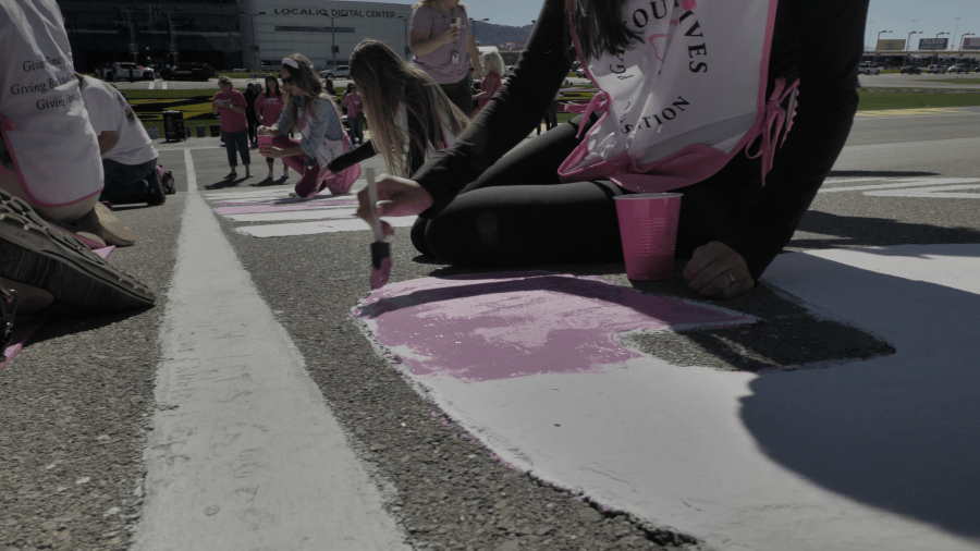 Survivors painted the start/finish line pink in honor of National Breast Cancer Awareness month for the Oct. 14-15 NASCAR Weekend. (JB Public Relations)