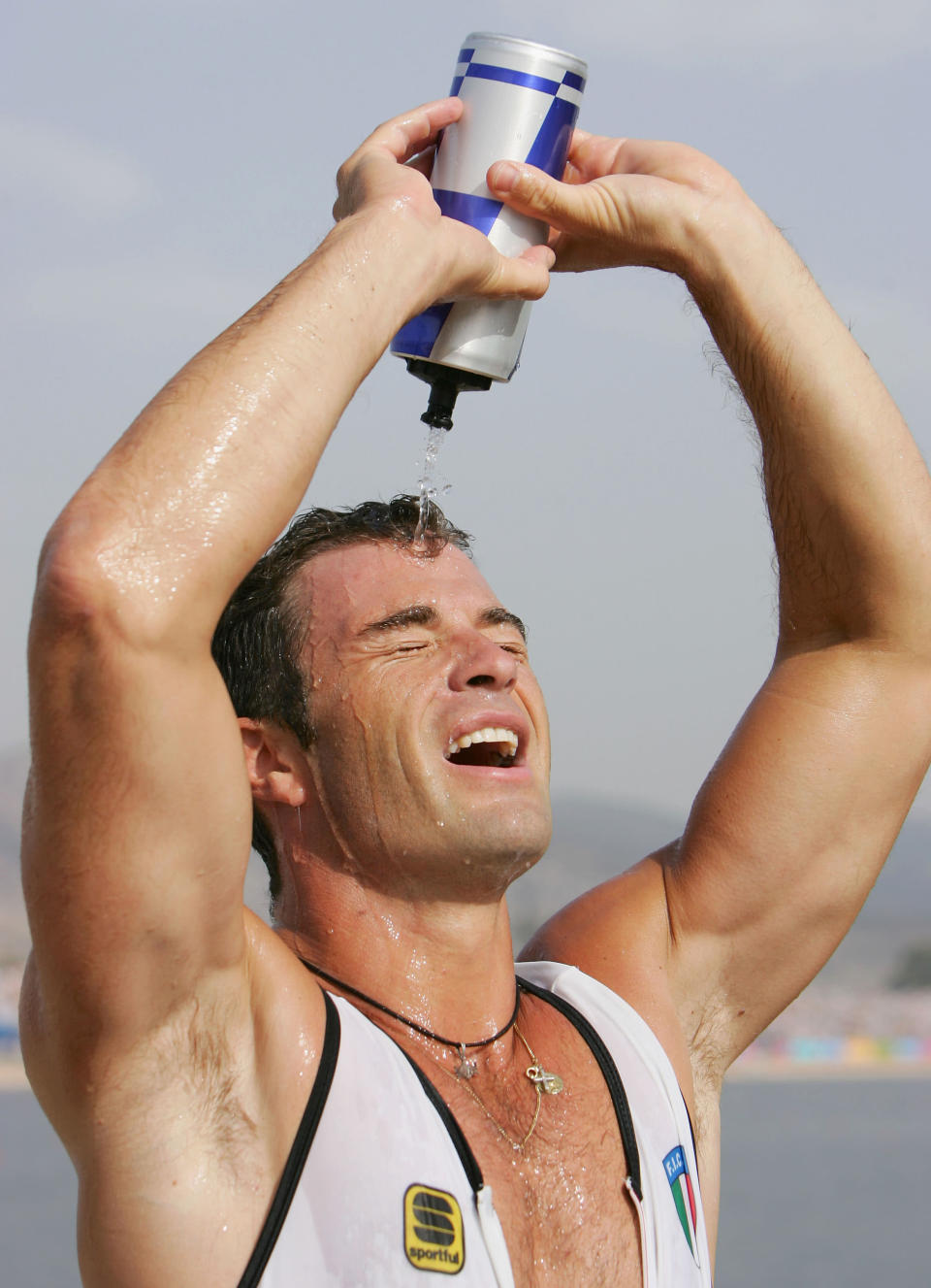 Antonio Rossi (and Beniamino Bonomi) of Italy celebrates winning the silver medal in the men's K-2 class 1,000 metre final on August 27, 2004 during the Athens 2004 Summer Olympic Games at the Schinias Olympic Rowing and Canoeing Centre in Athens, Greece. (Photo by Stuart Franklin/Getty Images)