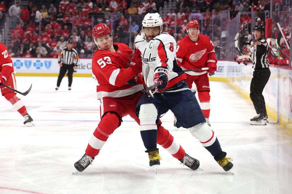 Capitals forward Alex Ovechkin tries to get to the puck around Red Wings forward Moritz Seider during the first period on Tuesday, Feb. 27, 2024, at Little Caesars Arena.