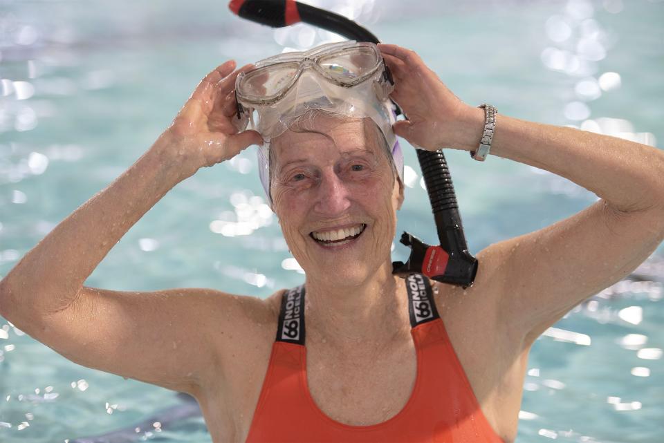 Falmouth swimmer Susan Baur who founded Old Ladies Against Underwater Garbage will be honored as a coastal resiliency hero April 4 by American Red Cross of Massachusetts. Baur suits up Tuesday with her mask and snorkel at the YMCA pool in West Barnstable, ahead of swimming 24 laps.