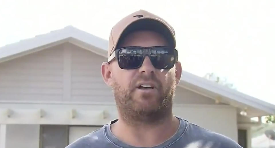 A man speaks on camera about rescuing a whale off Burleigh Heads.