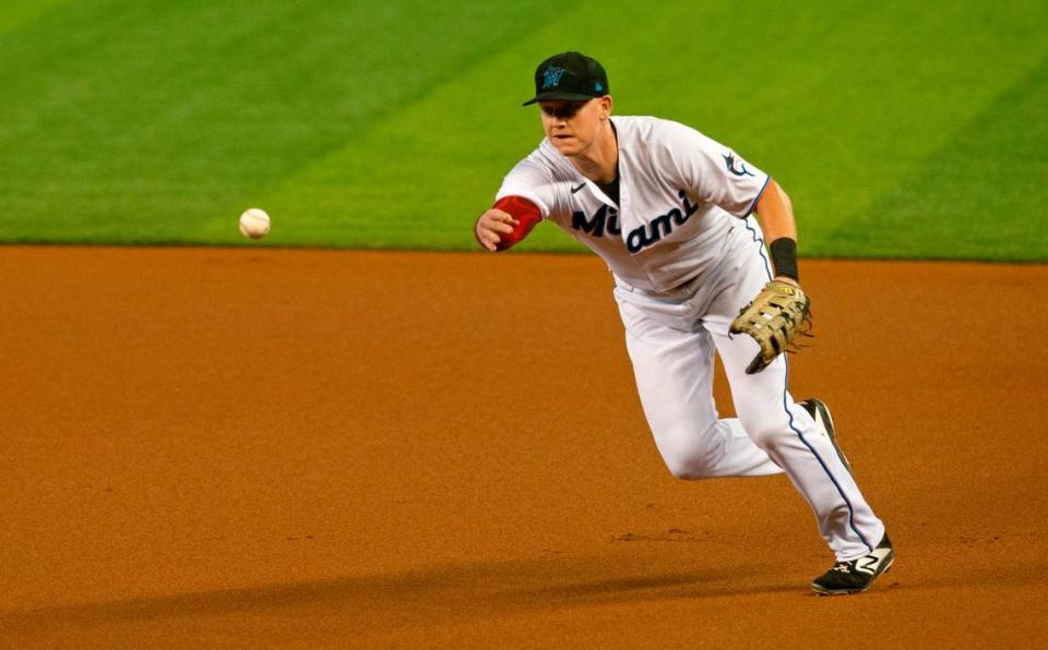 Miami Marlins first baseman Garrett Cooper (26) throws to first to put out Boston Red Sox center fielder Alex Verdugo (99) during the first inning of a baseball game against the Boston Red Sox at at Marlins Park in Miami on Wednesday, September 16, 2020.