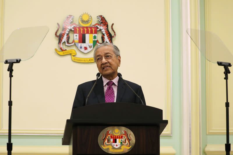 Malaysia's Interim Prime Minister Mahathir Mohamad speaks during a news conference in Putrajaya