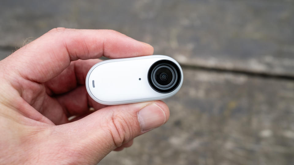 The tiny Insta360 Go 3 held between finger and thumb
