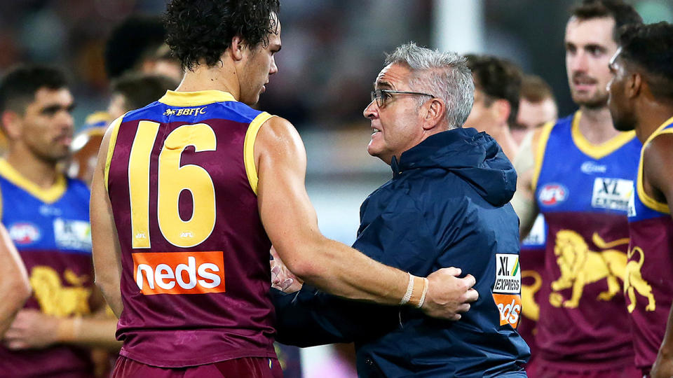 Cam Rayner and Chris Fagan are pictured speaking at three quarter time against the Gold Coast Suns.