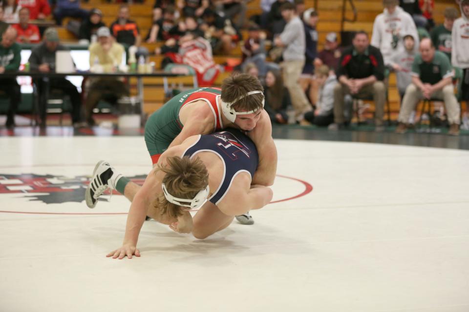 Oak Harbor's Hayden Buhro takes down Lakota's Braxton Quaintance in the 165-pound championship match.