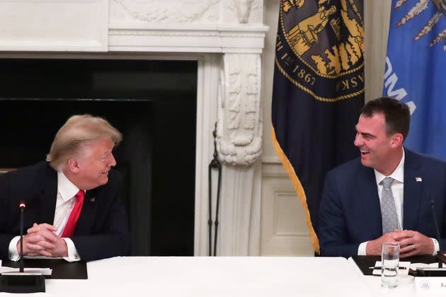 Oklahoma Gov. Kevin Stitt talks to former president Donald J. Trump in 2020 at the White House at a roundtable on reopening businesses during the coronavirus pandemic. (Photo: Alex Wong via Getty Images)