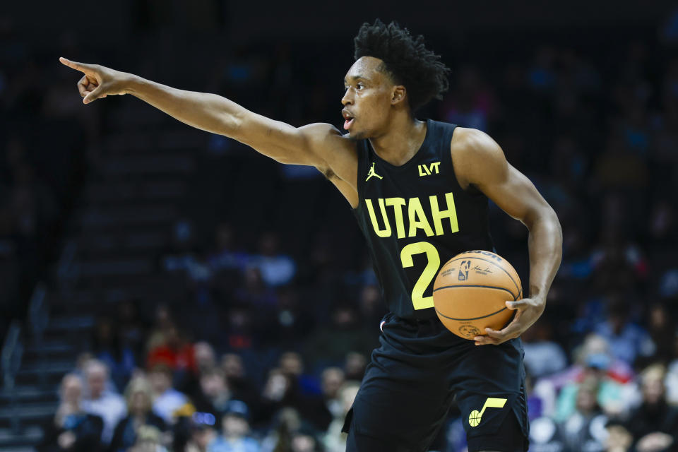 Utah Jazz guard Collin Sexton directs the offense against the Charlotte Hornets during the first half of an NBA basketball game in Charlotte, N.C., Saturday, Jan. 27, 2024. (AP Photo/Nell Redmond)