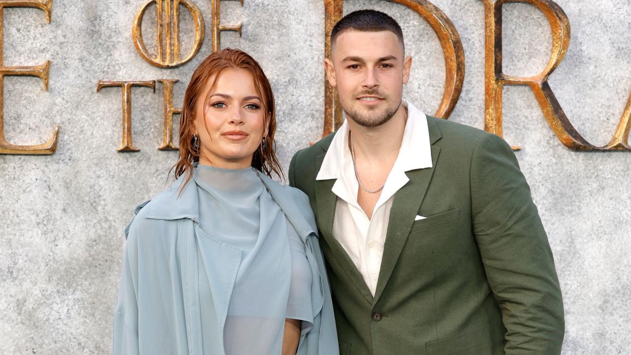 Tasha Ghouri in a blue sheer dress and Andrew Le Page in a green suit