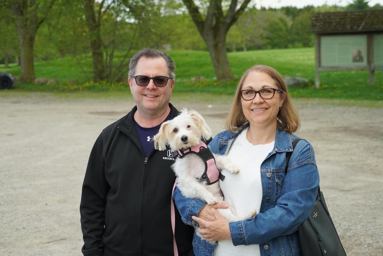 Rob Bull says he estimates he pulled 20 ticks off his Jack Russell, Roxy, after a 1 km walk through Dumfries Conservation Area in Cambridge. (Cameron Mahler/CBC - image credit)