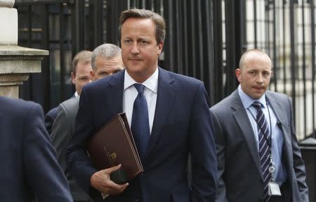 Britain's Prime Minister David Cameron walks to Parliament after leaving Number 10 Downing Street in London September 1, 2014. REUTERS/Luke MacGregor