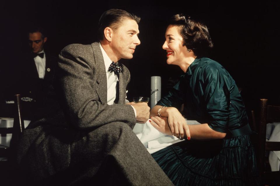 Ronald Reagan and his wife Nancy Reagan gaze at one another across a table, circa 1952 (Getty Images)