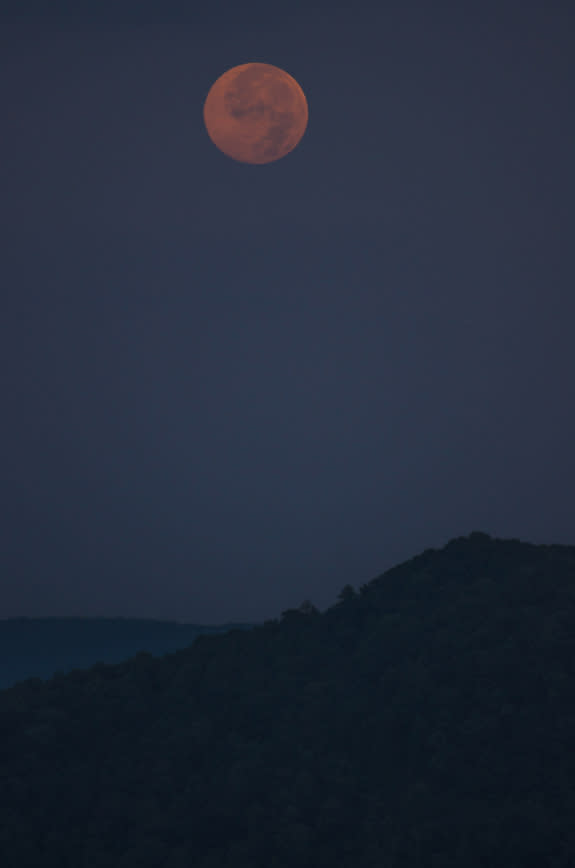 The Blue Moon full moon of July 2015 shines over Table Rock Mountain in South Carolina in this amazing view by photographer Shreenivasan Manievannan on July 31, 2015.